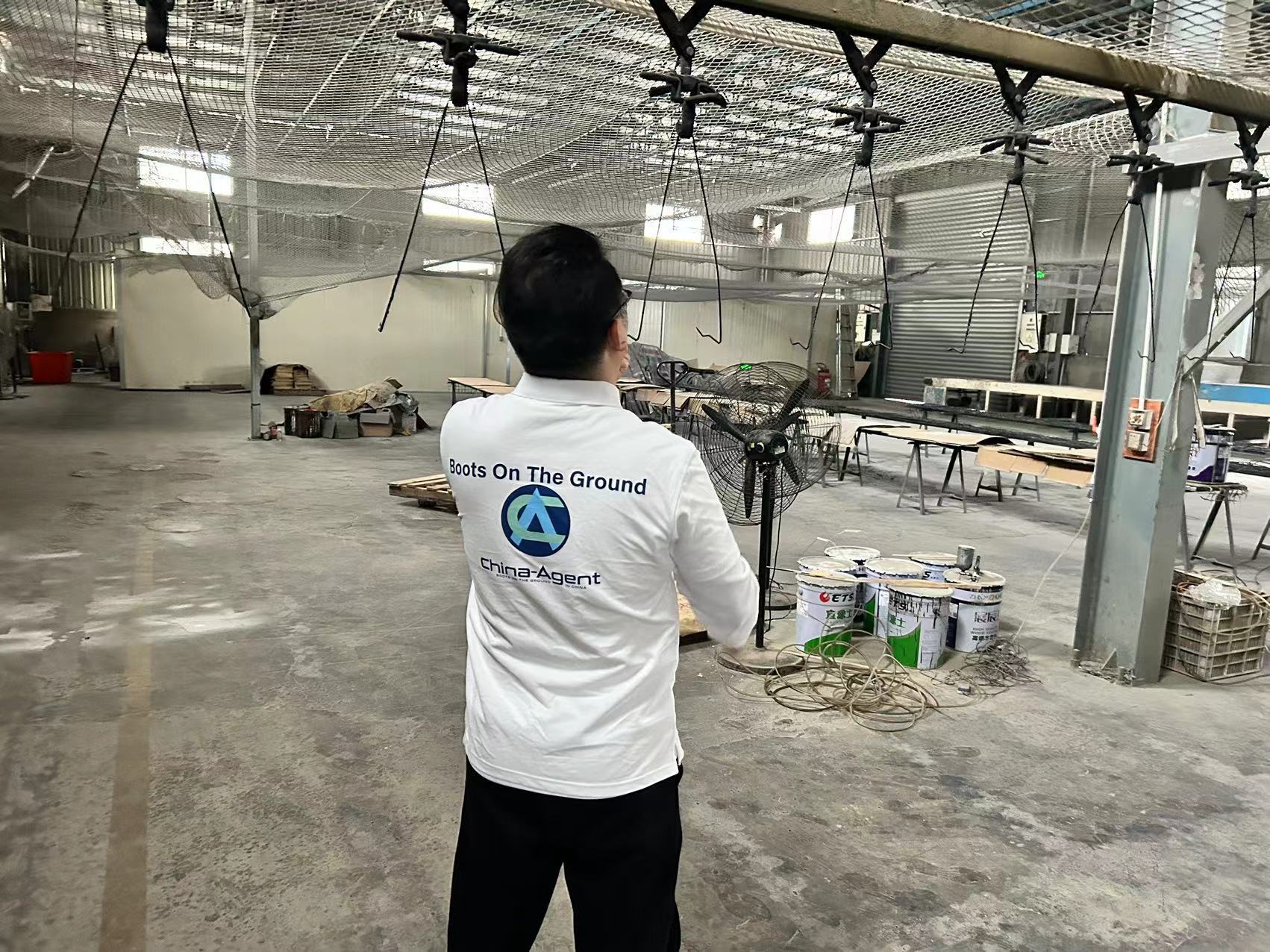 China Agent team member on a factory floor in Guangzhou — Boots On The Ground